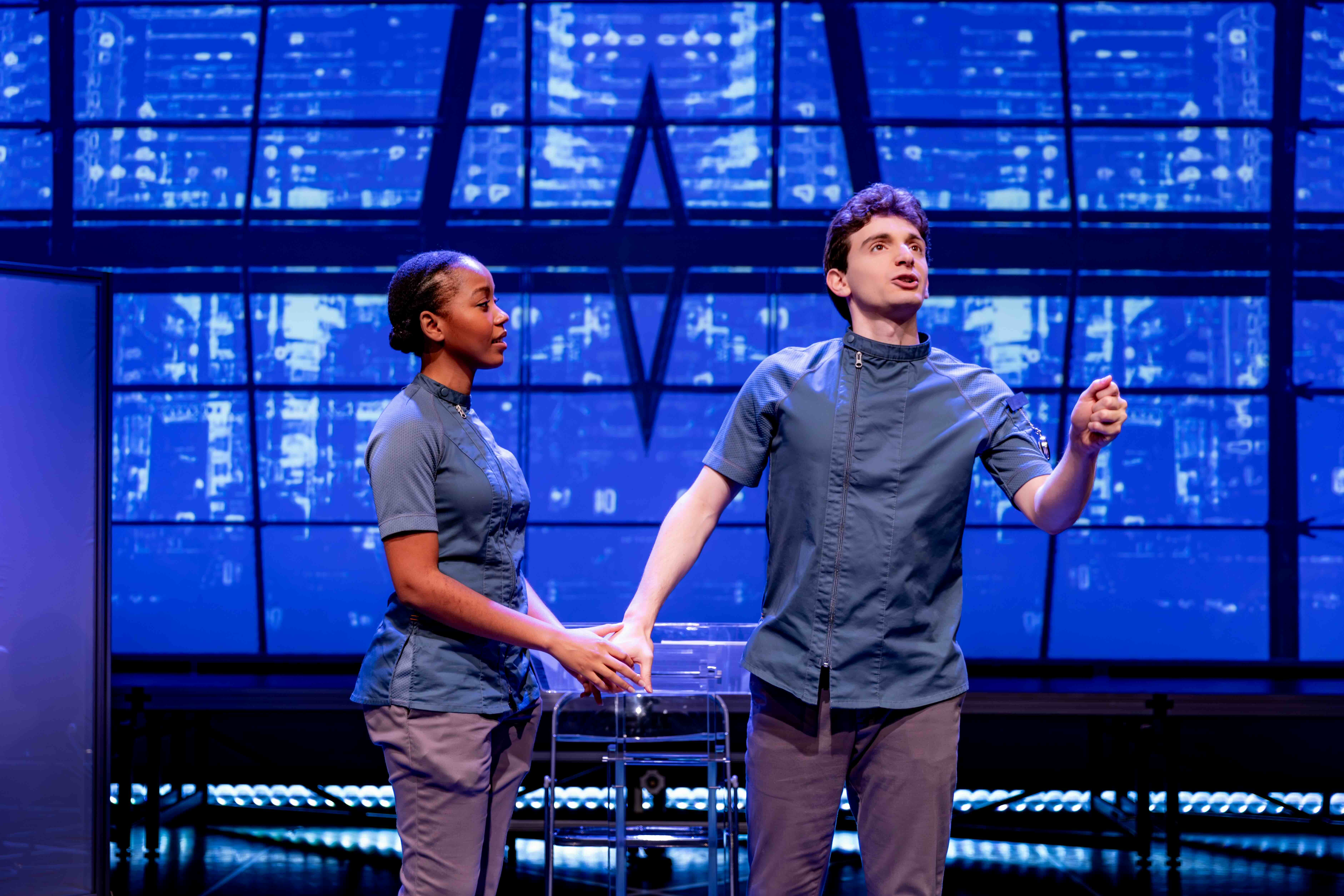  Cassandra Umaña as O-90 and Aaron Greenberg as D-503. 