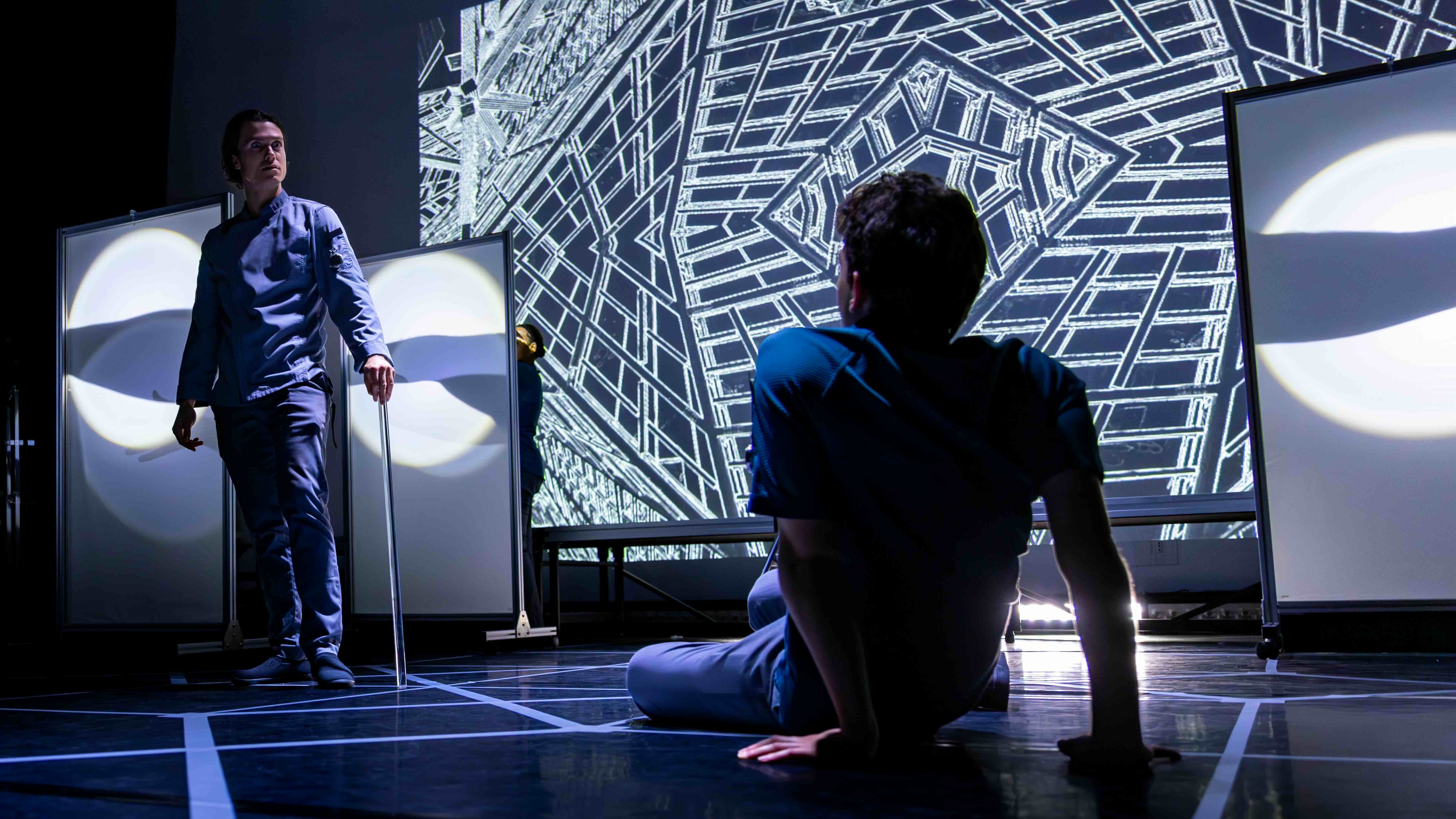  Crosby Lloyd as the Benefactor and Aaron Greenberg as D-503. 