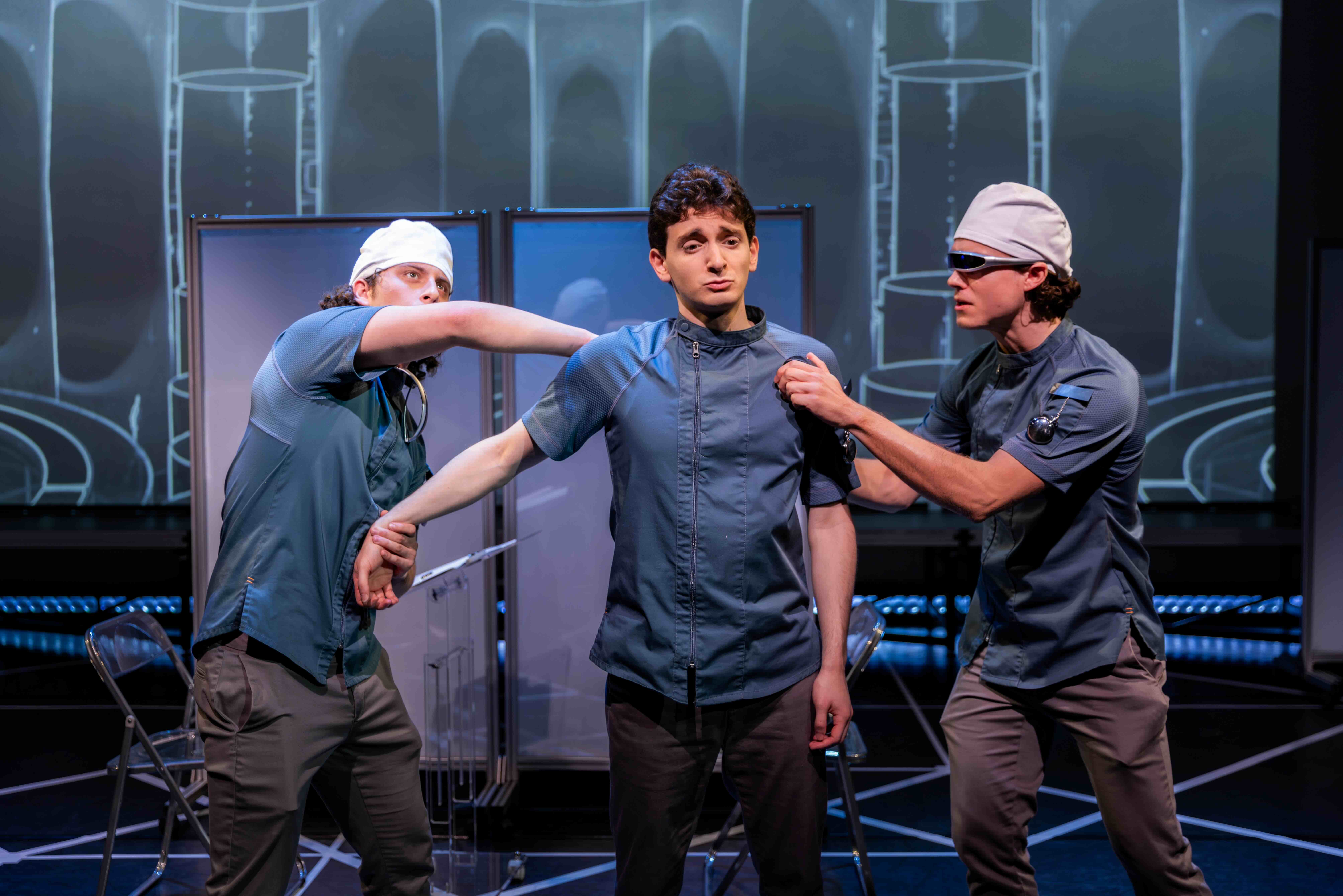  Nathan Reder as Surgeon 2, Aaron Greenberg as D-503 and Crosby Lloyd as Surgeon 1. 