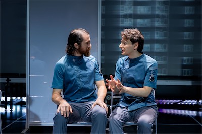 Ian Cramer as S-4711 and Aaron Greenberg as D-503